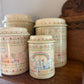 Set of 4 Home Sweet Home Ceramic Canisters w/ Cross-stitch pattern