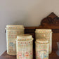 Set of 4 Home Sweet Home Ceramic Canisters w/ Cross-stitch pattern
