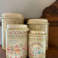 Set of 4 Home Sweet Home Ceramic Canisters w/ Cross-stitch pattern
